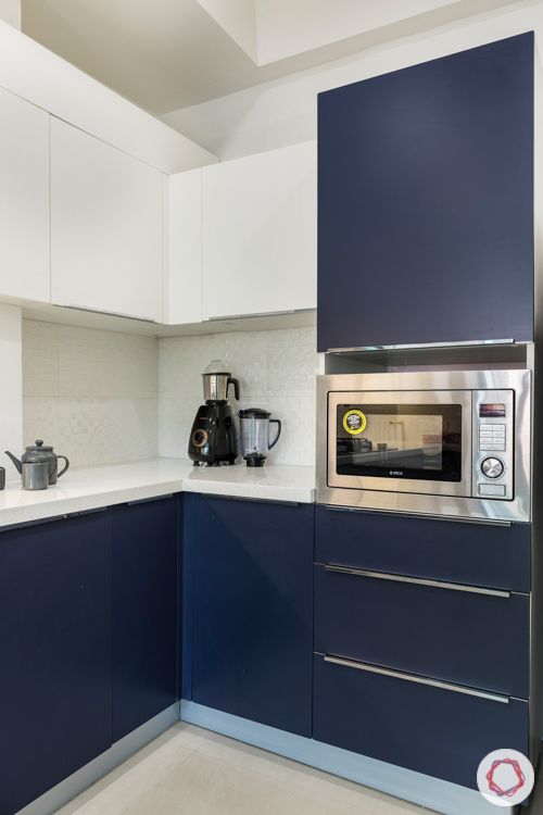 3-bhk-apartment-membrane-kitchen-white-and-navy-white-tile-backsplash-quartz-countertop-tall-unit