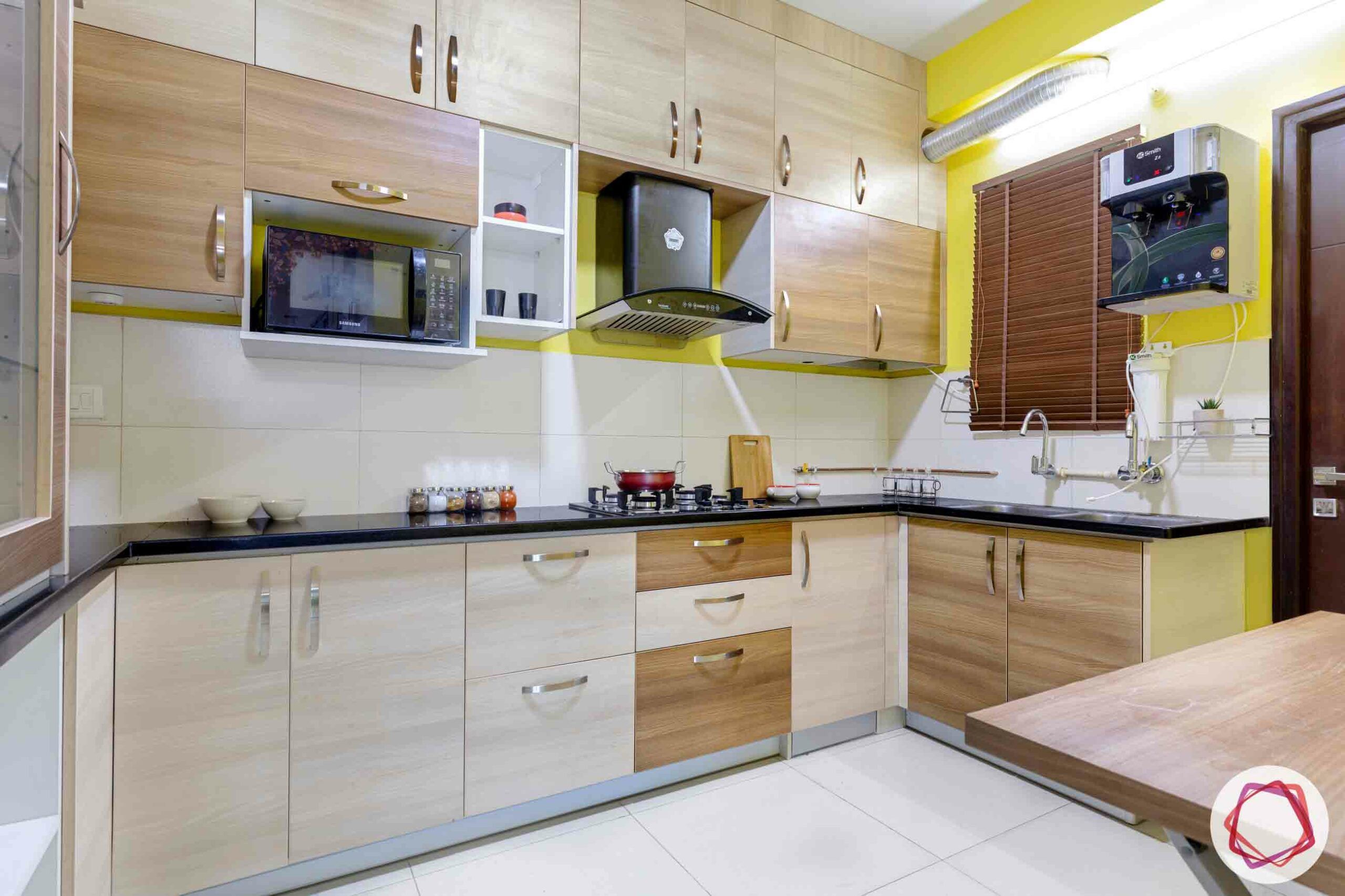 best interior designers in hyderabad-kitchen cabinets-wooden laminate-yellow wall