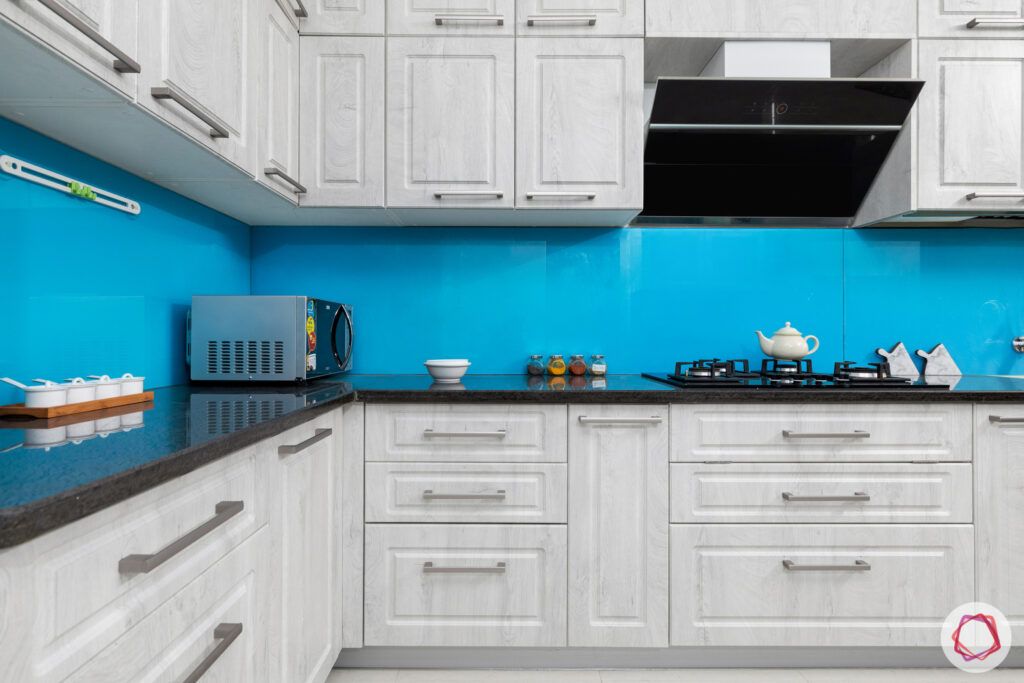 best interior designers in hyderabad-matte white cabinets-blue backsplash