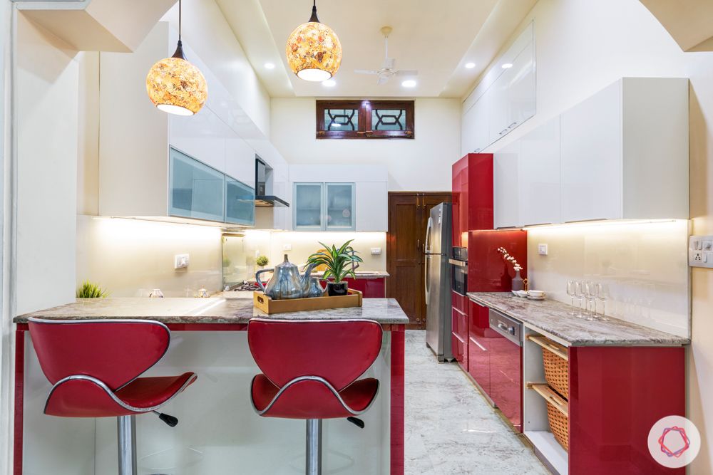best interior designers in hyderabad-red chairs-red kitchen-pendant lighting