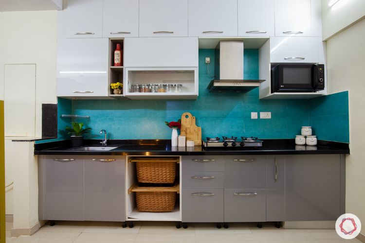 kalpataru serenity-blue backsplash-kitchen basket-white and grey cabinets