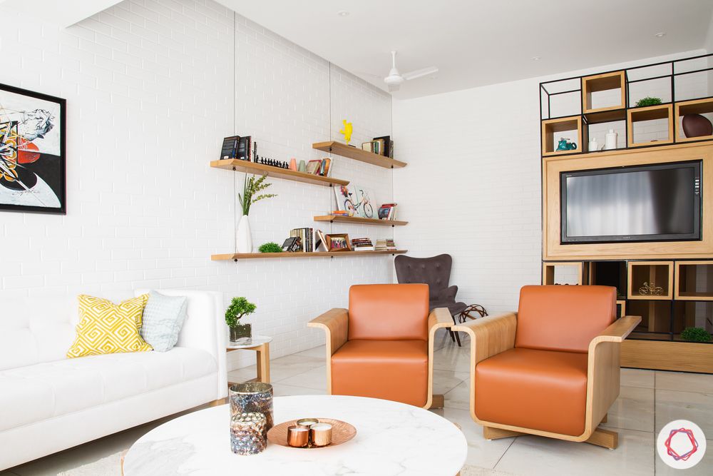 interior design in mumbai-leather armchaits-white couch
