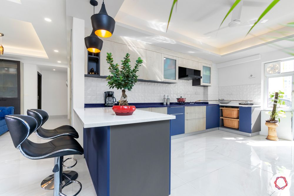  4 bhk home design-blue and white cabinets-baskets-U-shaped layout
