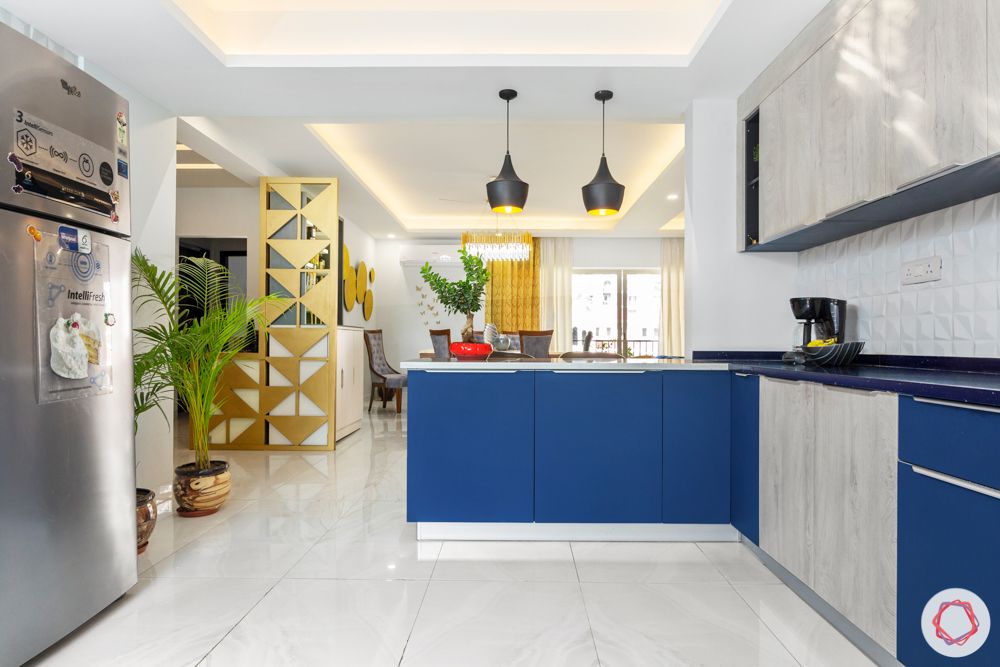  4 bhk home design-pendant lights-whire and blue cabinets