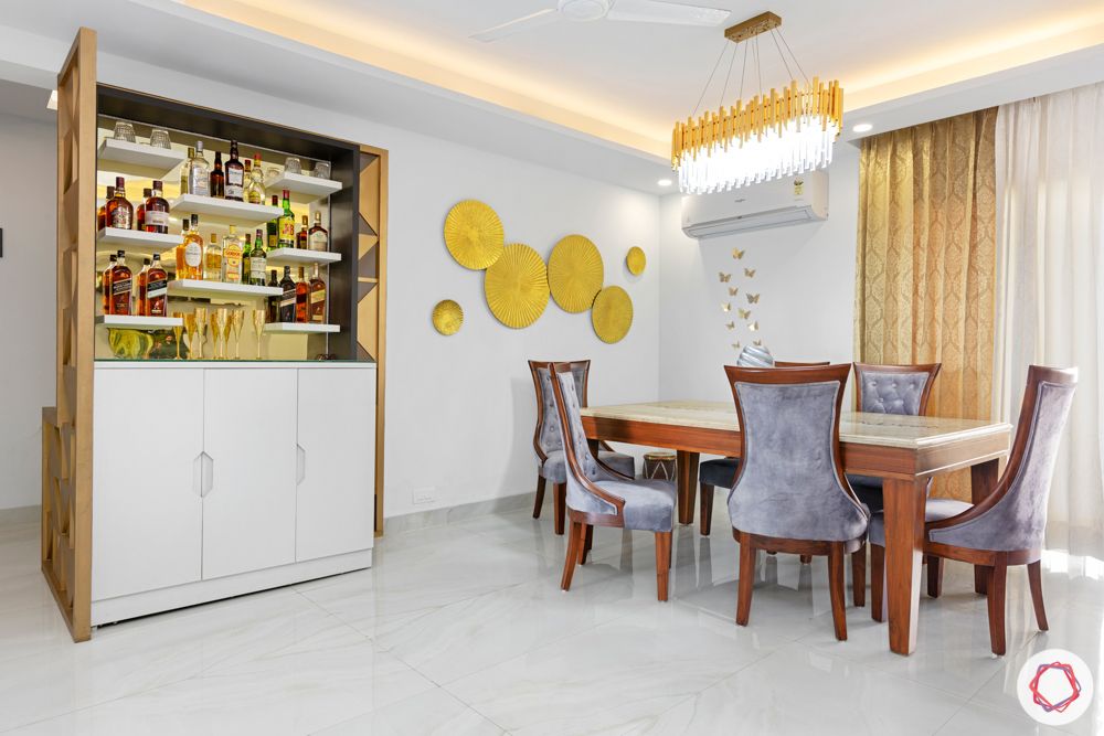 4 bhk home design-chandelier-velvet dining table-bar unit