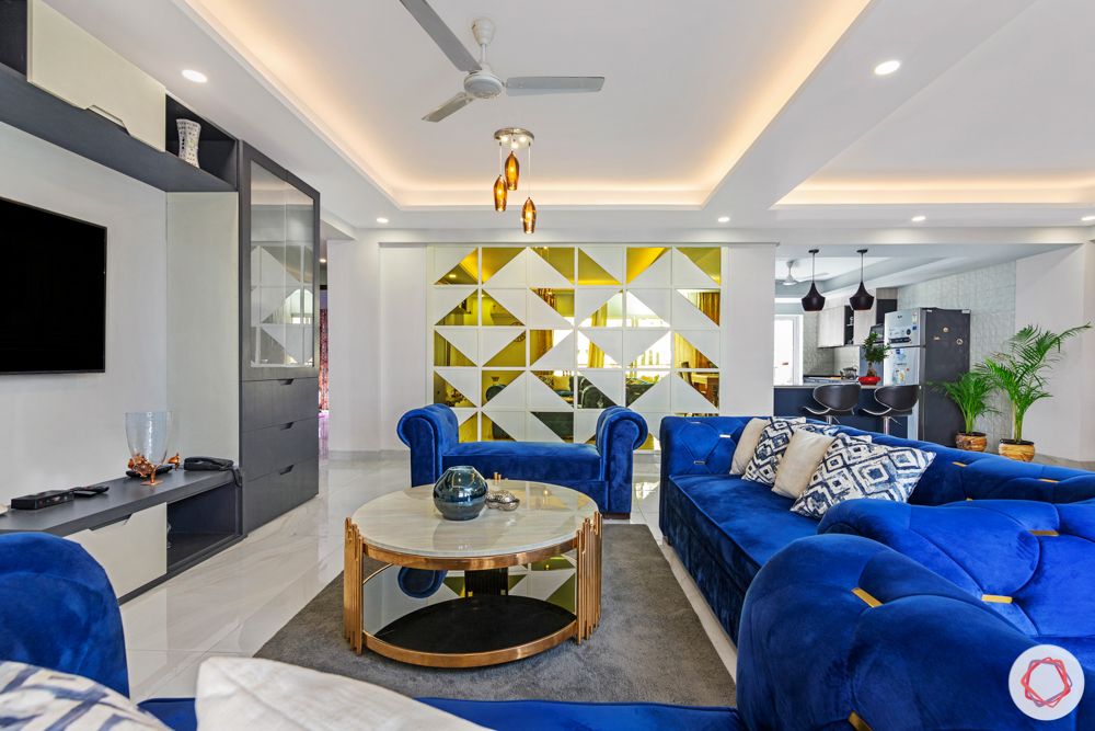 4 bhk home design-blue velvet furniture-brass coffee table