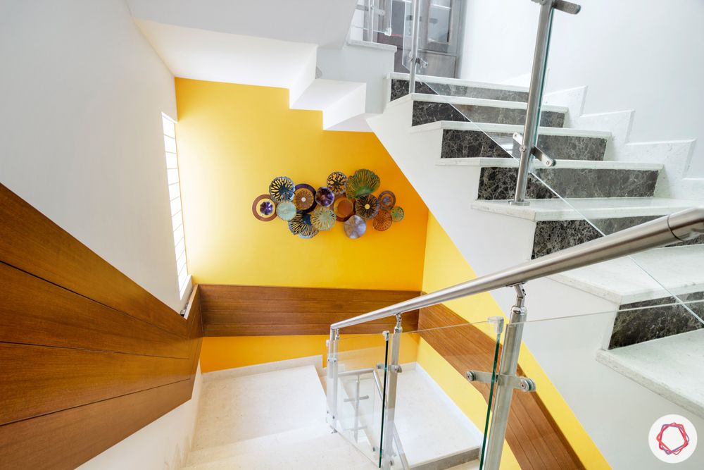 villa-interior-design-staircase-yellow-vastu-veneer-cladding