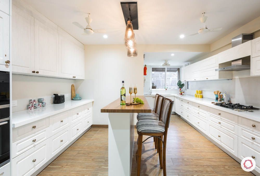 timeless kitchen designs- wooden flooring-white cabinets-kitchen island