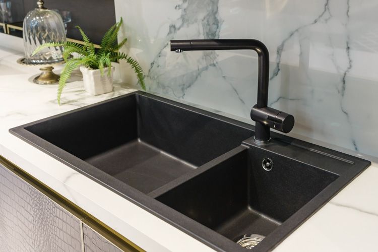 black kitchen sink with 2 holes