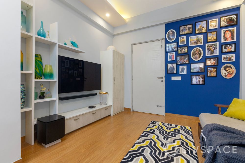 4 BHK flat design-rug-gallery wall-blue wall-tv unit-laminate finish