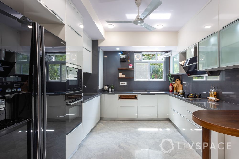 kitchen-renovation-white-cabinets-grey-wall-breakfast-table-fridge