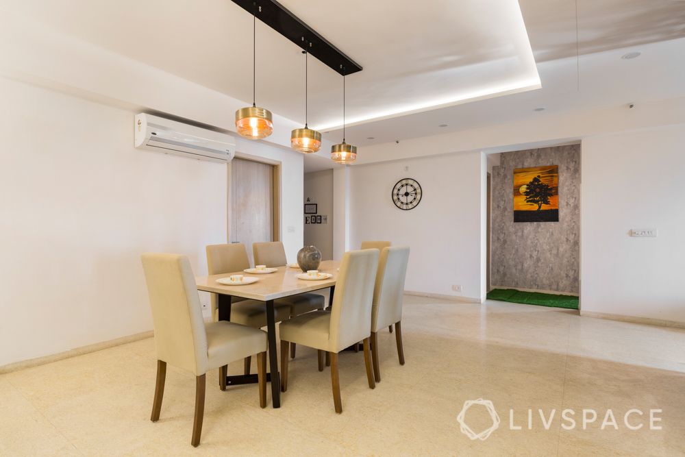 4 bhk in gurgaon-upholstered chair-pendant lights-false ceilings