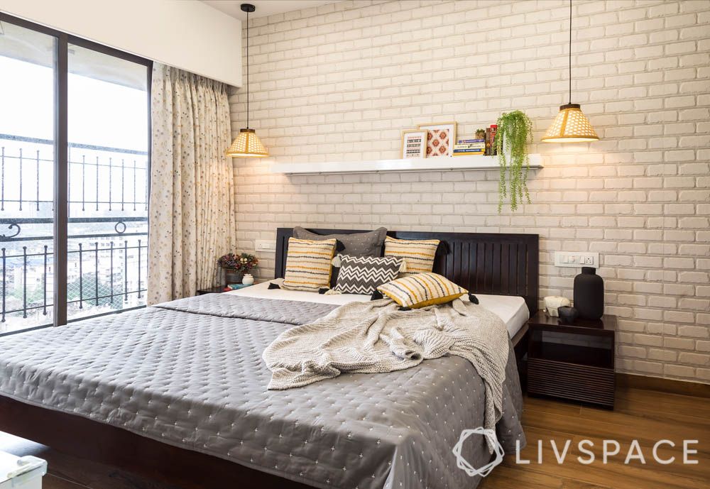 Gender Neutral Bedrooms for Couples-exposed brick wallpaper-display shelf-wooden bed-pendant lights
