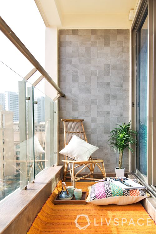 floor cushions-balcony seating-grey tiled wall