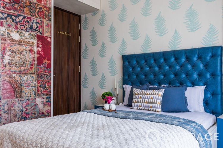 how to decorate home in low budget-blue headboard-red wardrobe-printed wallpaper