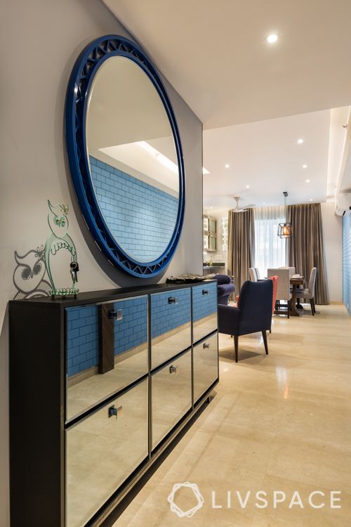 vastu for prosperity-blue round mirror-foyer-cabinets