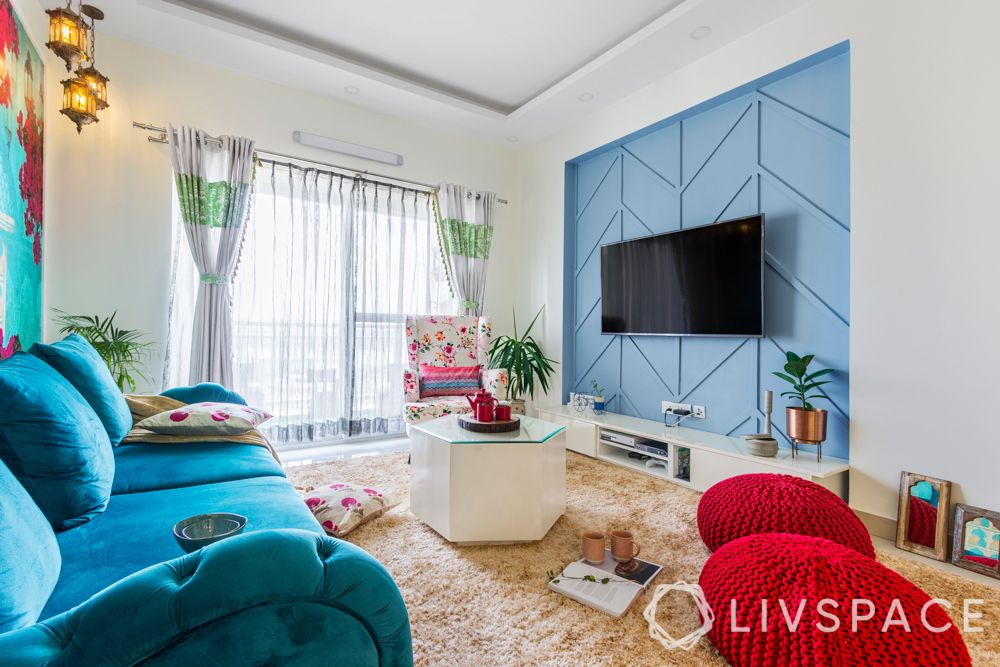 interiors in bangalore-blue bougainville wallpaper-floor seating-wall trims-tv unit design