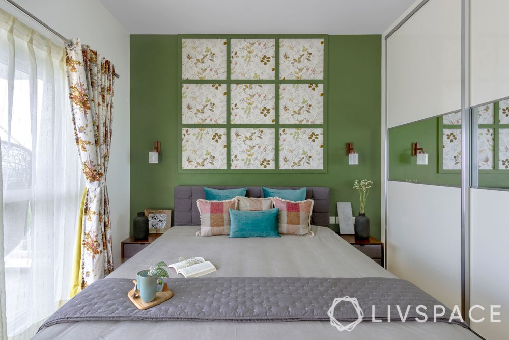 interiors in bangalore-green painted walls-wall trims-upholstered bed-white wardrobes-floral 
wallpaper 
