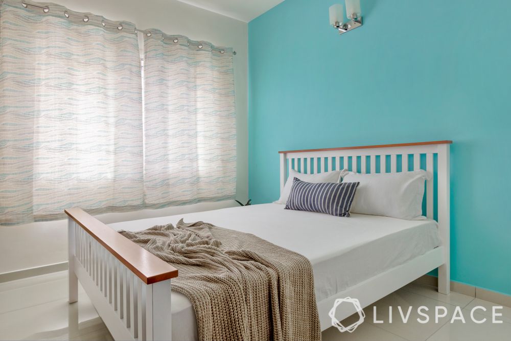 interior design firms in bangalore-turquoise wall-white bed