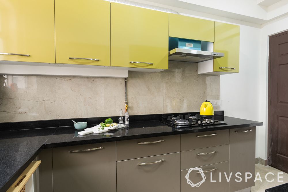 3bhk-flat-design-kitchen-granite countertop-yellow cabinets