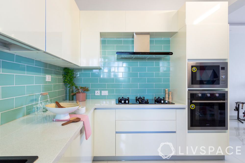 small indian kitchen design in l shape-blue tiled backsplash-white kitchen