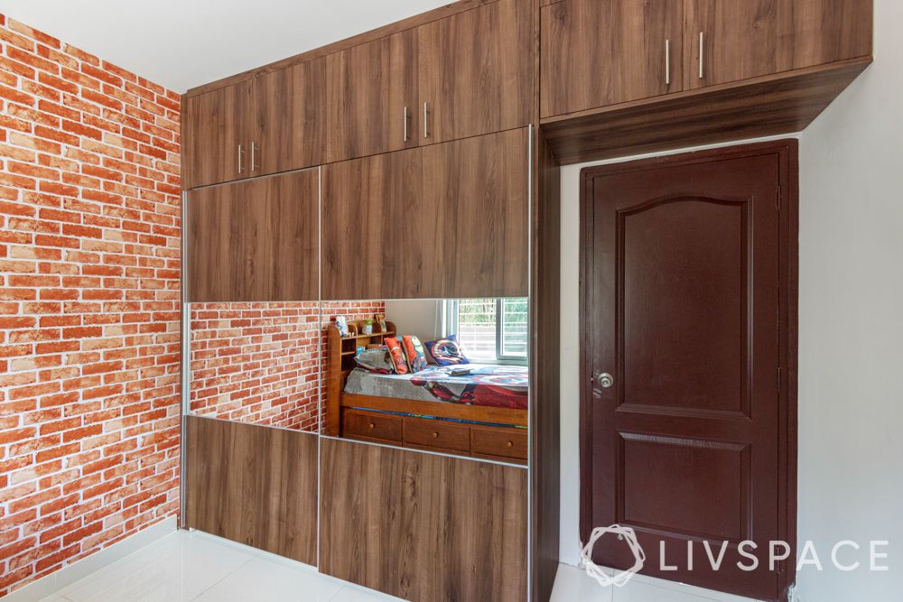 3 bhk home design-exposed brick wallpaper-wooden wardrobe-mirror panel