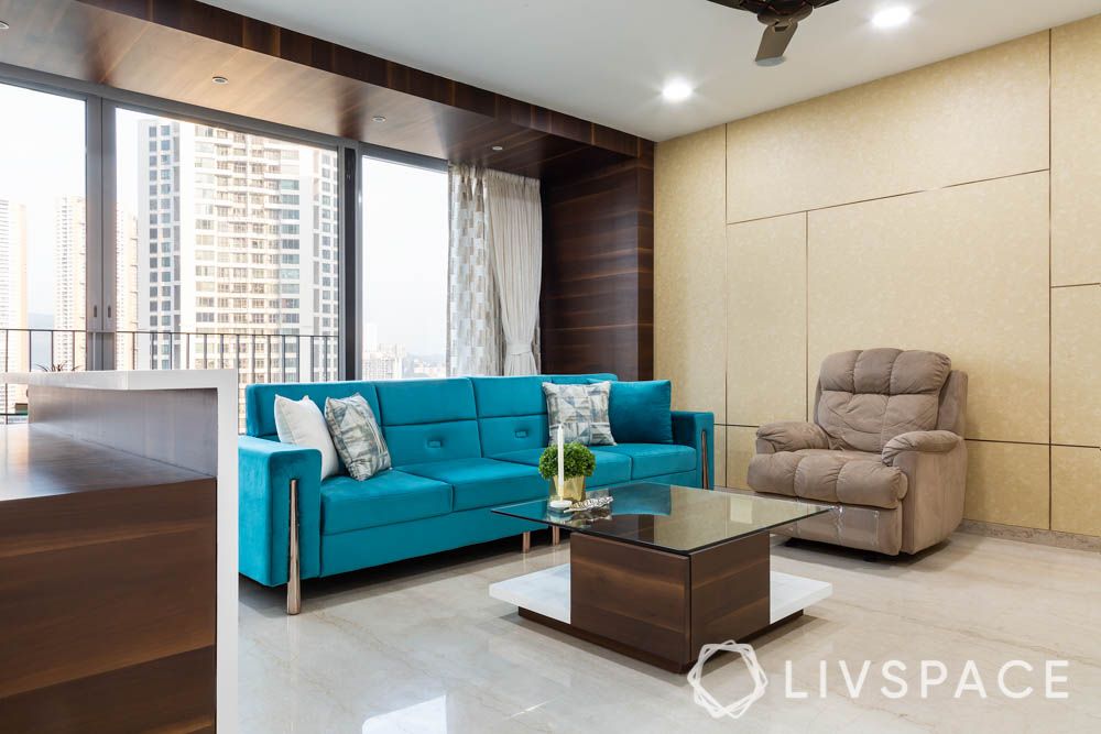 3bhk-house-design-blue-sofa-recliner-wallpaper