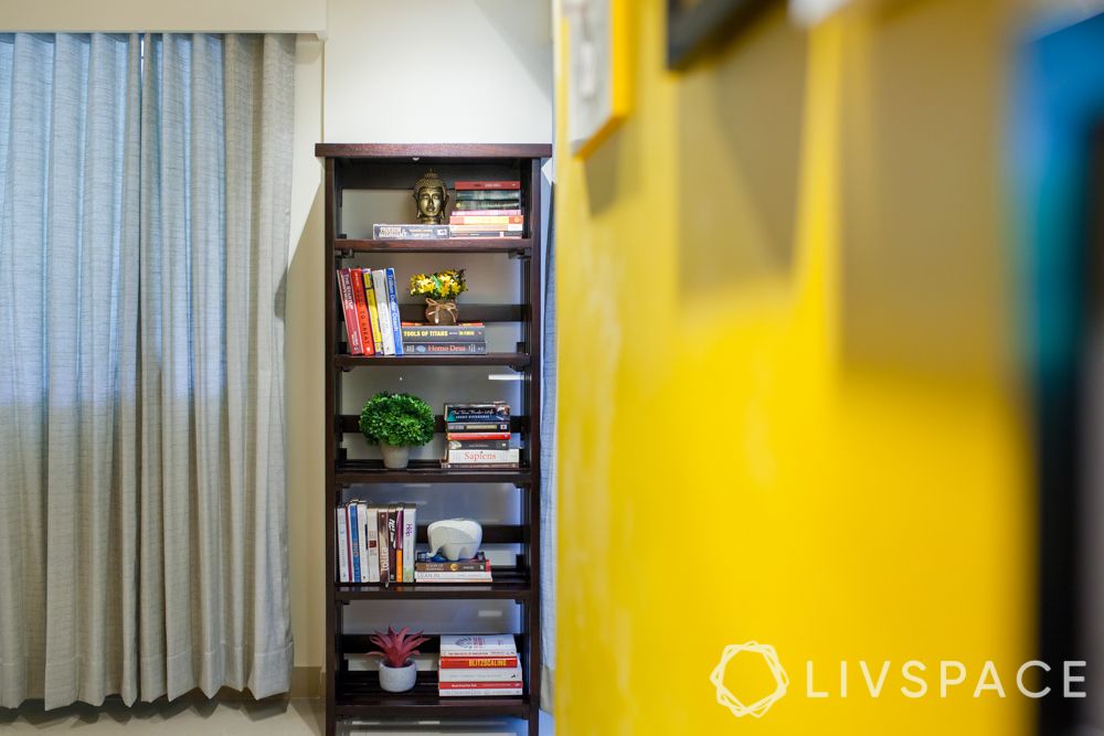 Open storage-bookshelf-yellow wall