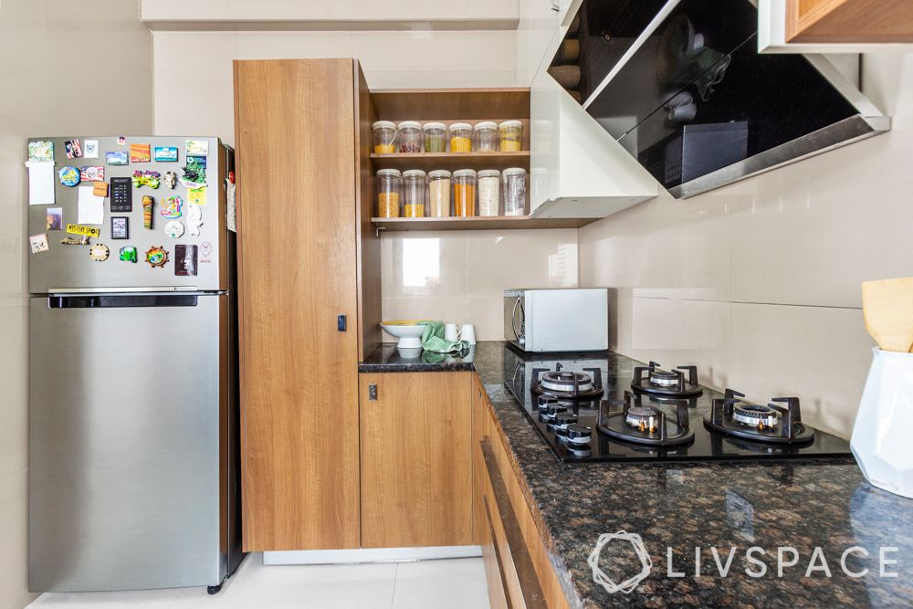 simple interior design-wooden shelves-acrylic cabinets-U shaped kitchen-tall unit
