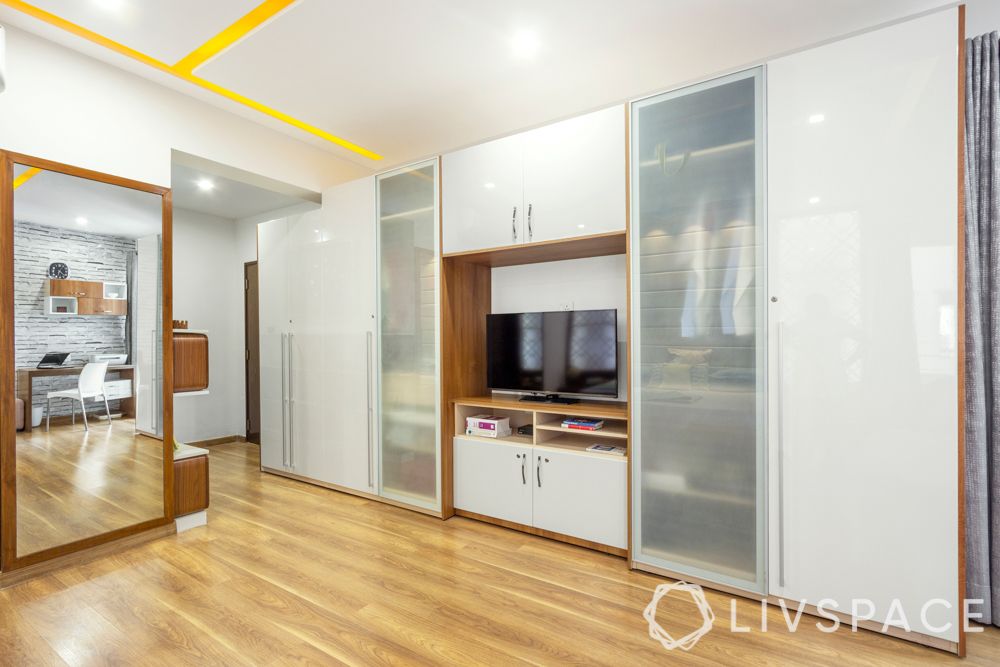 frosted glass-white wardrobe-tv unit-wooden flooring