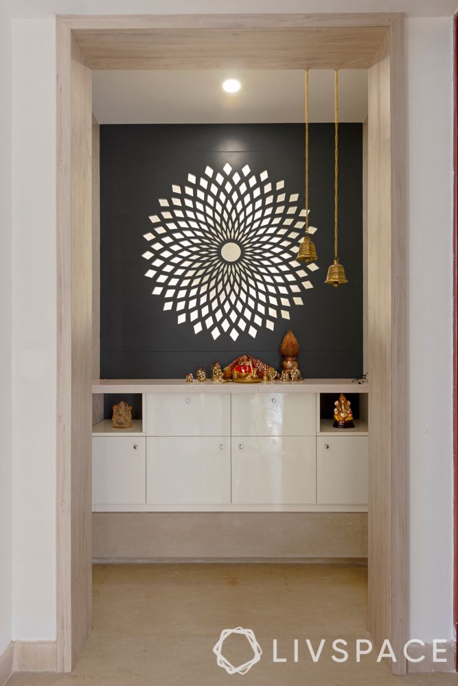 villa house design-MDF panel-backlit pooja room-hanging bells-storage-niche wall