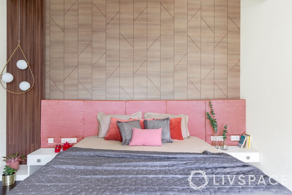 villa house design-wooden panelling-pendant lights-pink headboard-bench-orange armchair-study unit