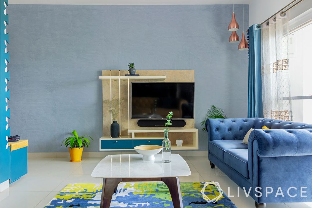 2bhk design-living room-tv unit-suede sofa-false ceiling