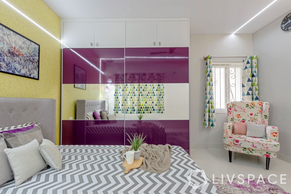 2bhk design-master bedroom-yellow textured paint-high gloss laminate wardrobe-false ceiling design