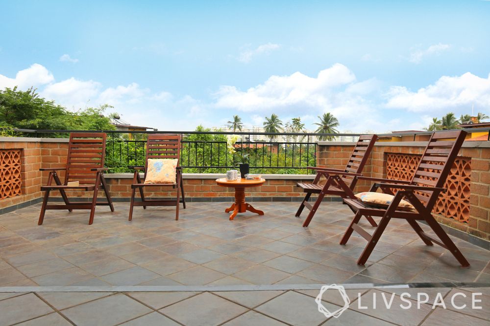 villa interior-wooden outdoor chairs-red oxide flooring