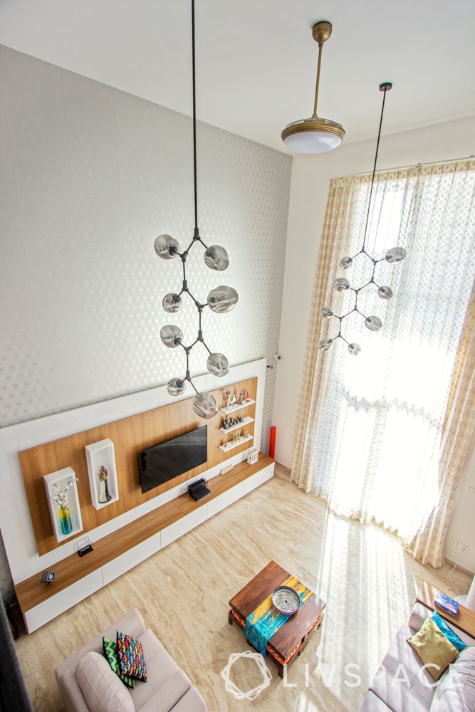 villa interior-wooden flooring-long cluster of lights