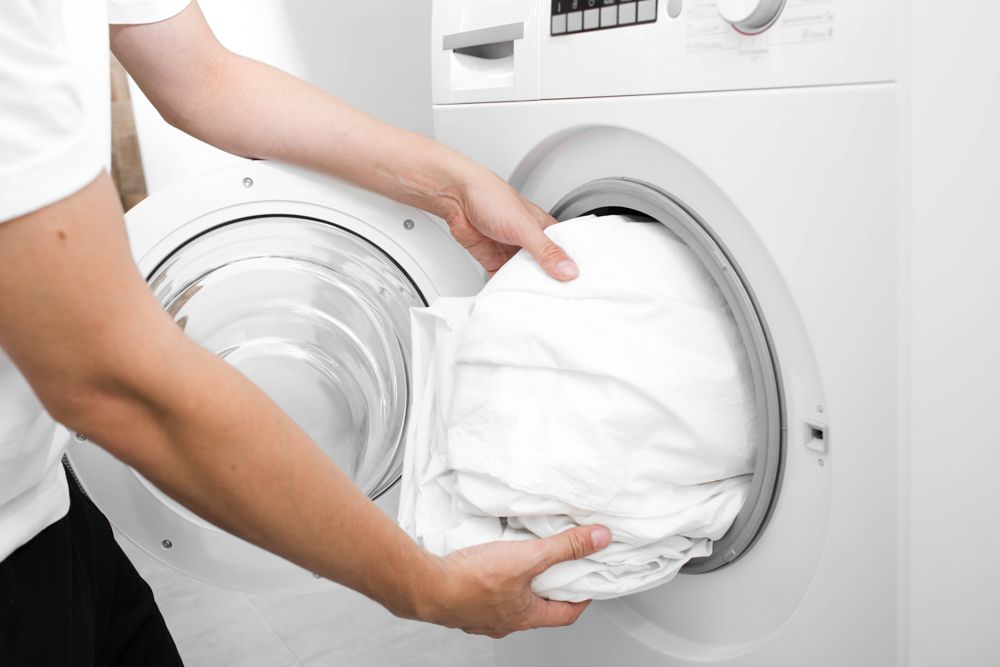 how to reduce allergies at home-washing machine-bedding