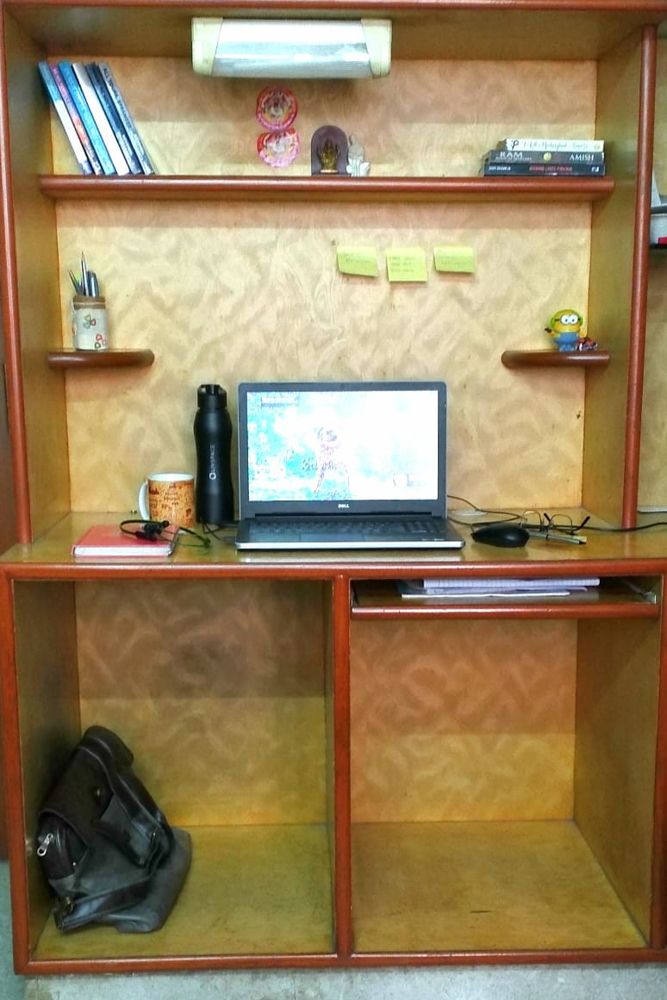 home office design-study unit-books-laptop-bottle