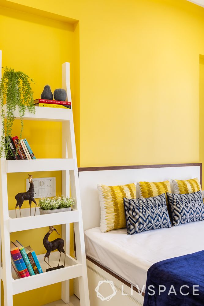 yellow wall paint-white ladder cabinet