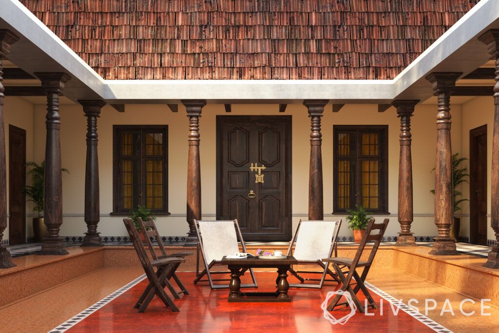 chettinad house-courtyard-tiled roof-pillars-teakwood door-chairs