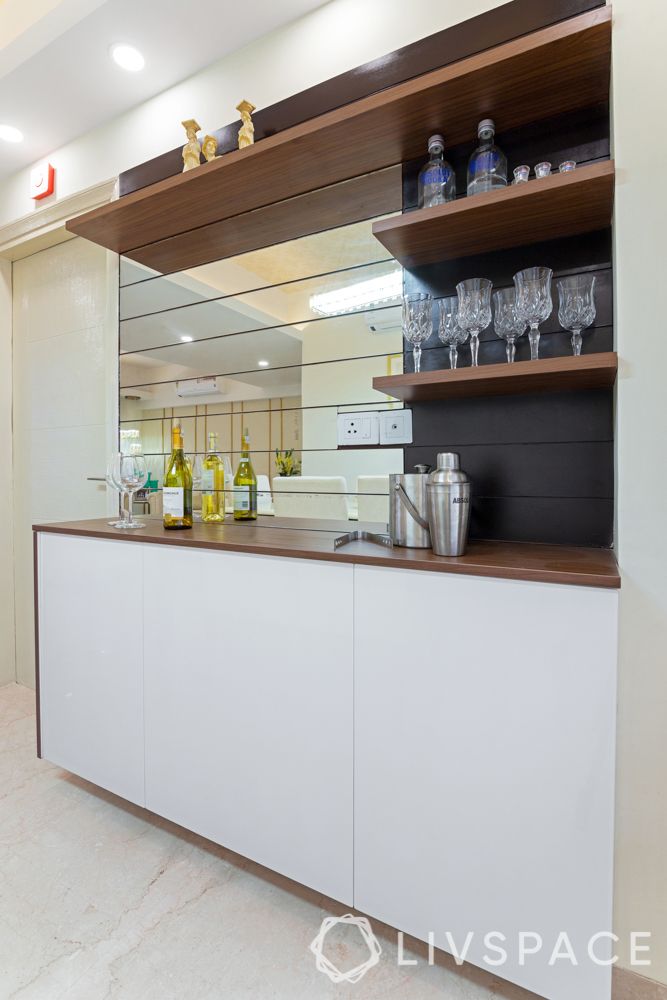 interior design company in gurgaon-dining room-custom bar unit-floating shelves-mirror panel