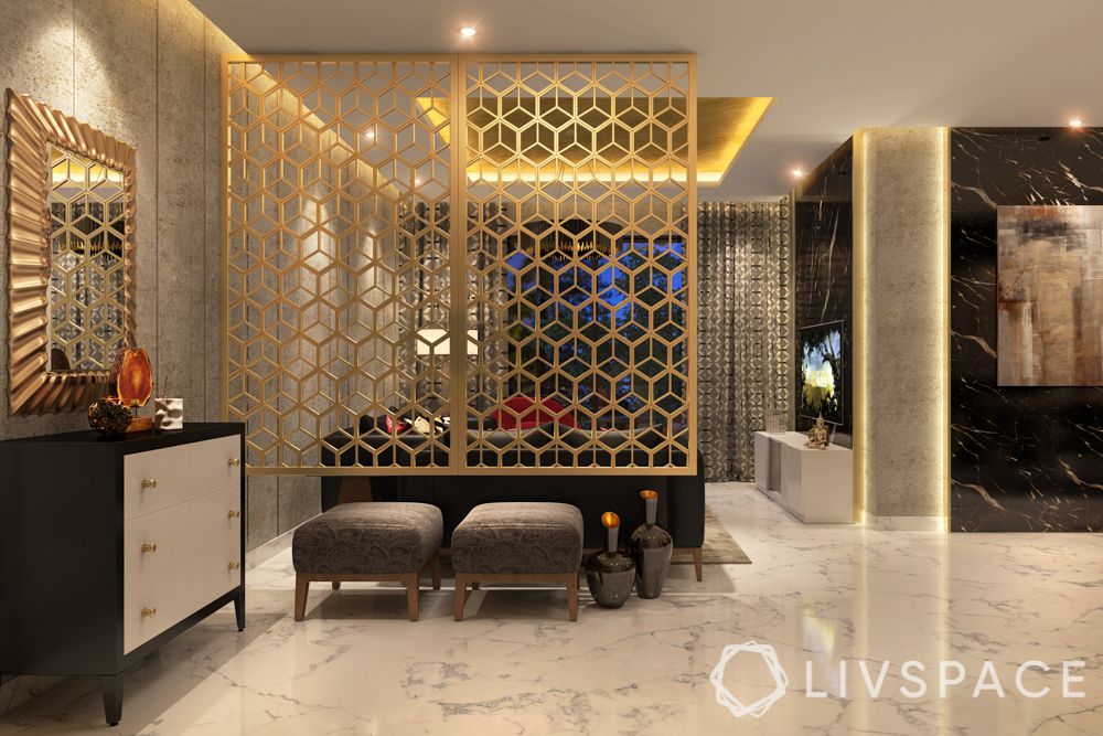 Foyer design-gold jaali-ottomans-mirror-cabinet