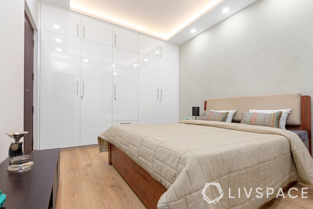 study unit-tv unit-blinds-false ceiling-upholstered bed-laminate wardrobes-white