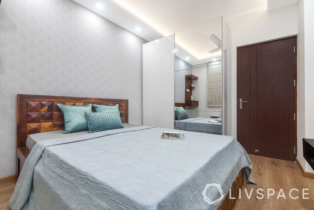 pooja unit-tv unit-blinds-false ceiling-wooden bed-laminate slide wardrobes-white mirror