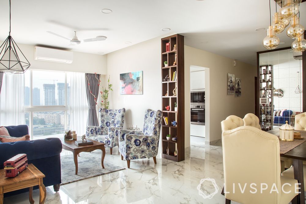 rainy season cleaning-wooden bookshelf-pendant- lights-floral chairs-dining table