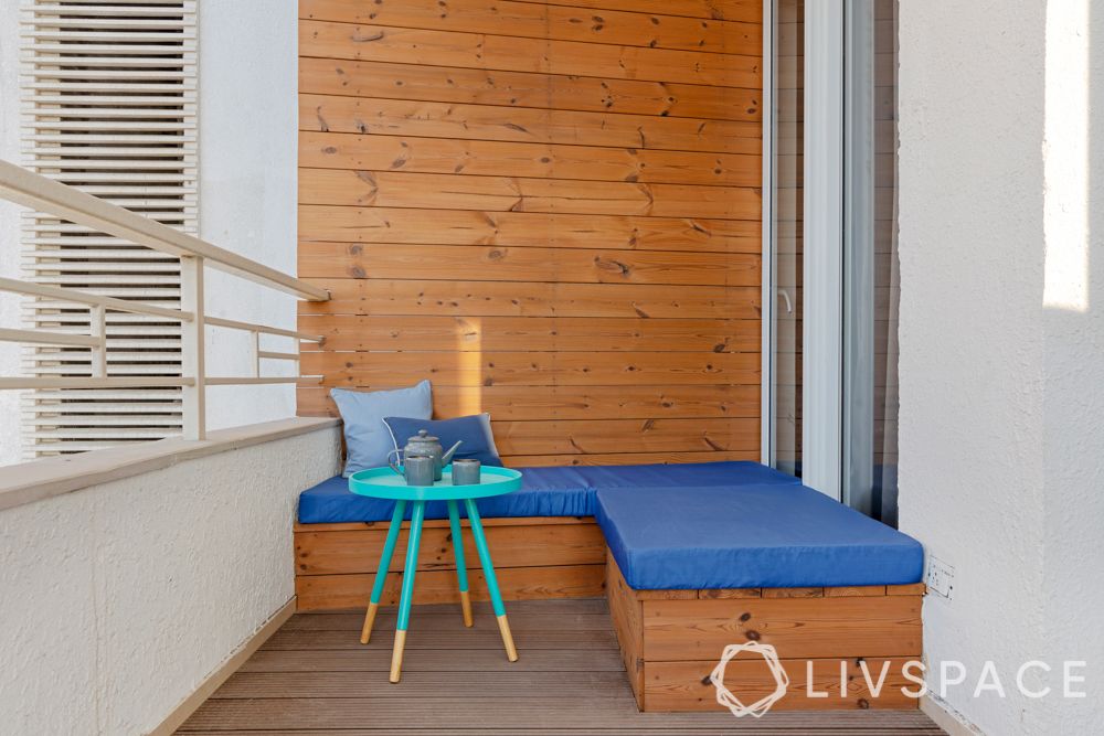 Balcony-table-cushioned seating-wooden panelling