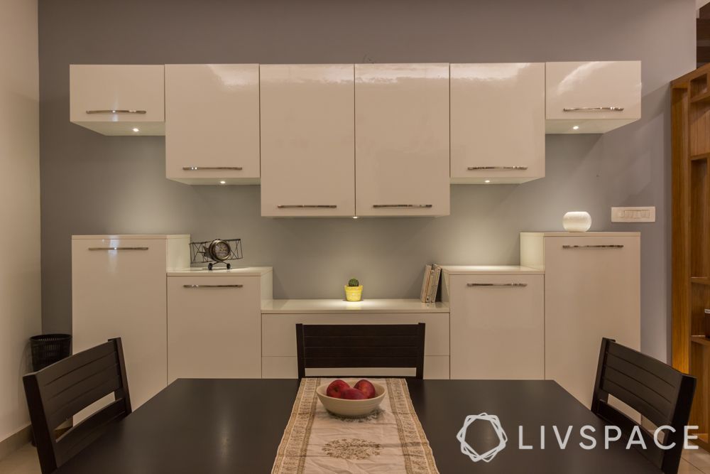 dining room storage idea-white acrylic cabinets, crockery cabinet