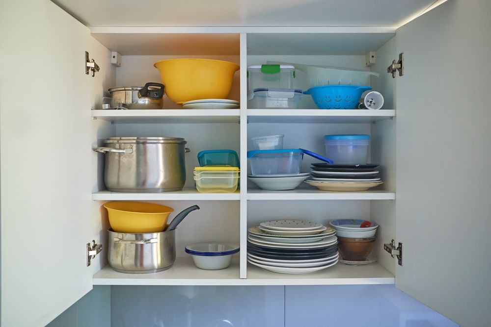 kitchen wall cabinets-stacked up utensils