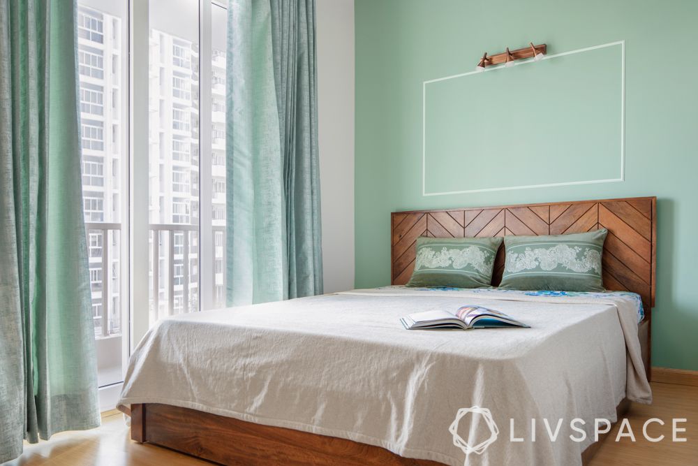 green accent wall-wooden bed