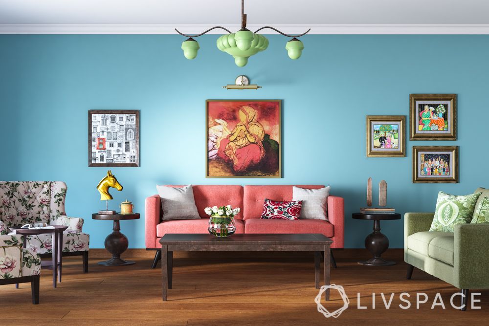 living-powder blue wall-coral couch-beige sofa-printed wingback chair-green lamp